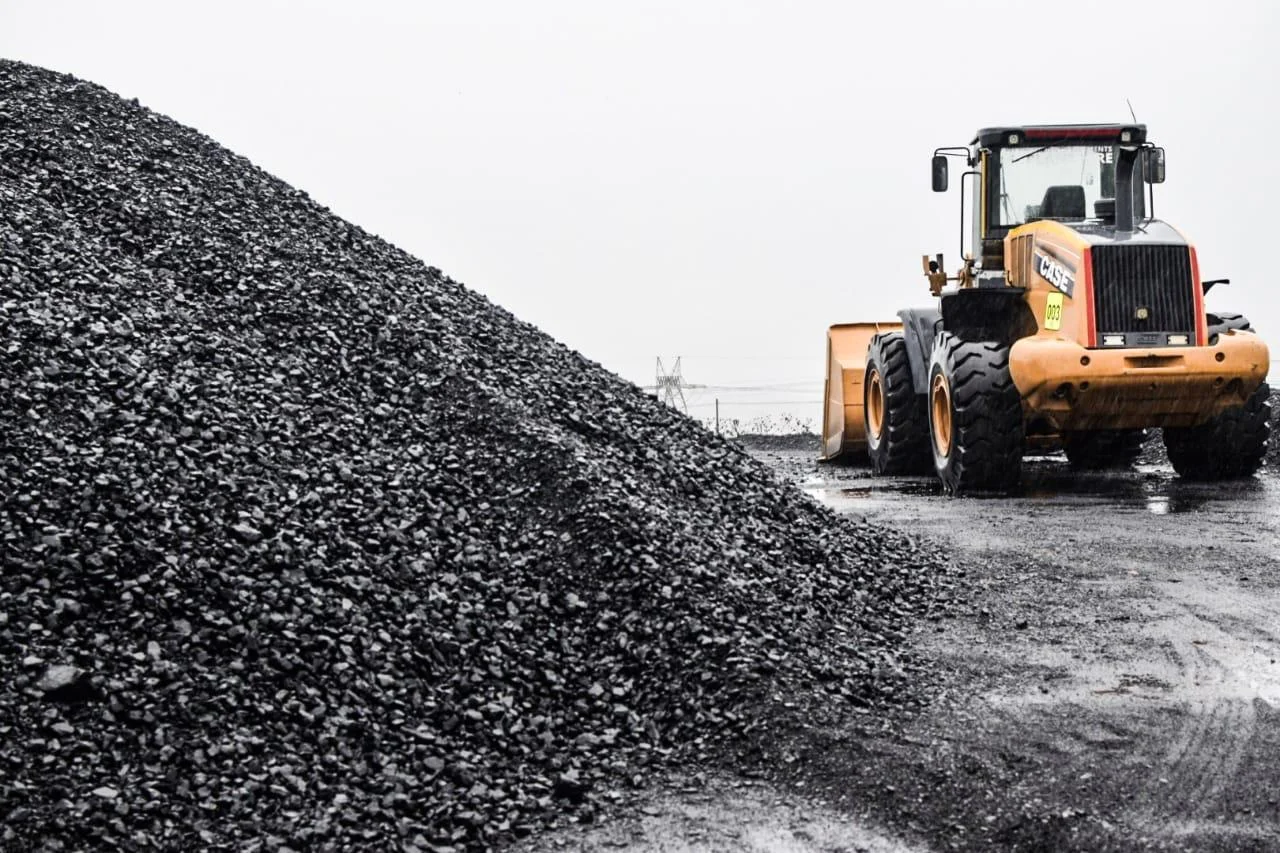 Wheel loader working a graded thermal coal stockpile